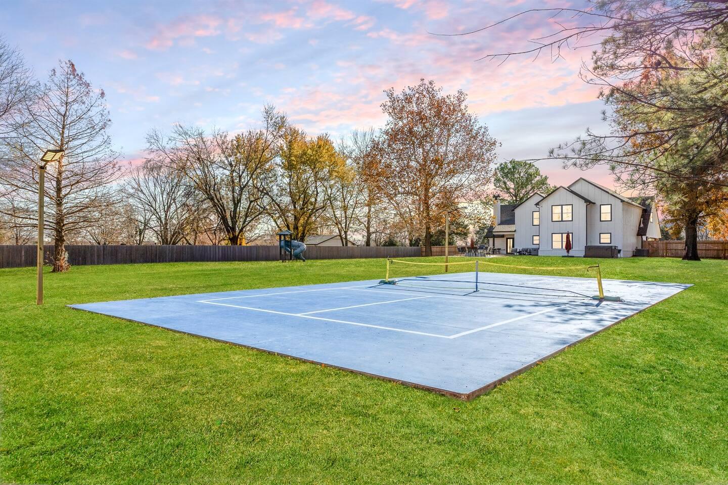 Private full-size lighted pickleball court at the Estate at Sunset in the evening